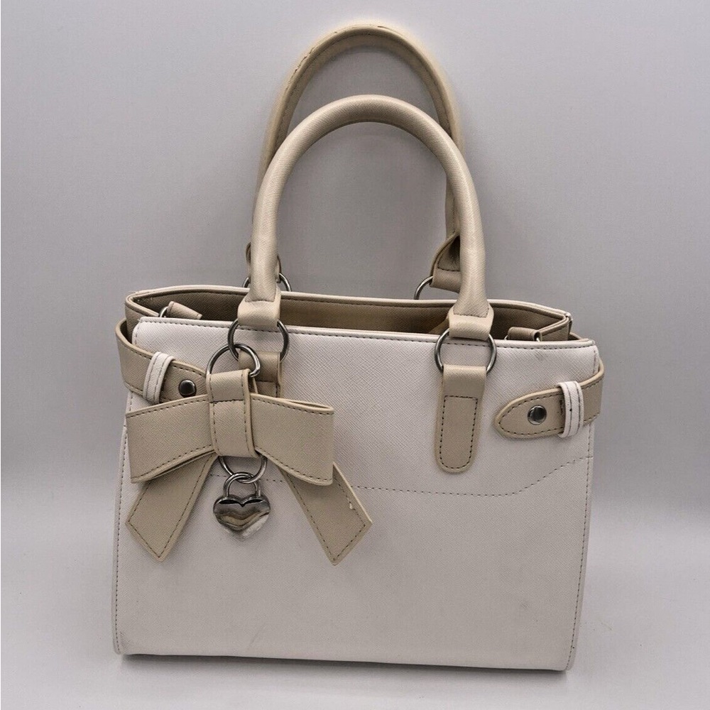Claire’s elegant Cream and Tan Women's Handbag with bow and charm